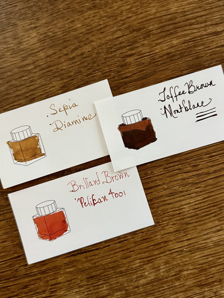 Three ink sample cards displaying different brown ink colors: 'Sepia' by Diamine, 'Toffee Brown' by Monteverde, and 'Brilliant Brown' by Pelikan 4001, each with an illustrated ink bottle.